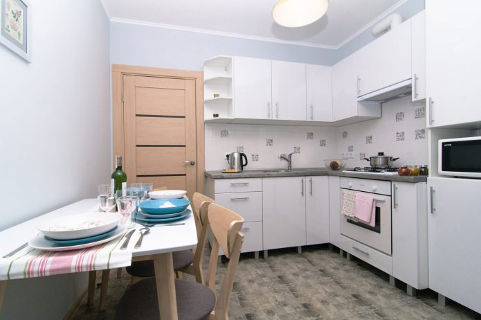 kitchen in white in a studio apartment kitchen in white in a studio apartment