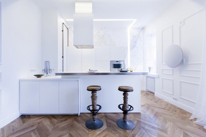 The interior of the combined kitchen-living room with a bar counter