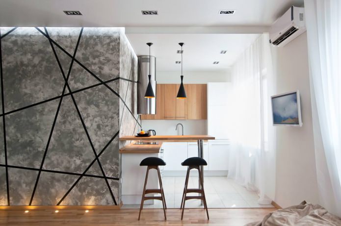 Separation of the kitchen and living room with a bar counter