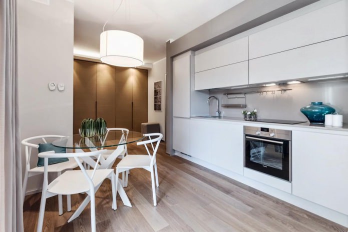 Glass table in the interior of the kitchen Glass table in the interior of the kitchen