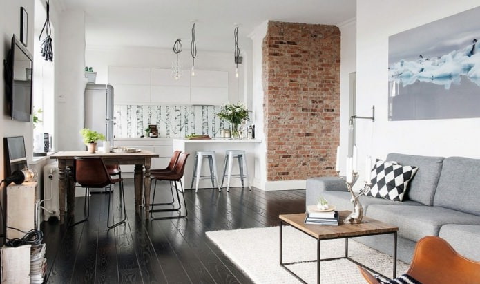 Brick in the interior of the kitchen-living room Brick in the interior of the kitchen-living room