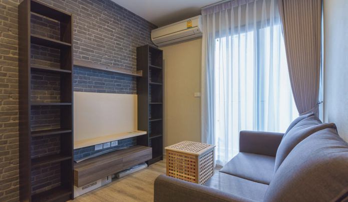 Wallpaper under gray brick in the interior of the living room Wallpaper under gray brick in the interior of the living room