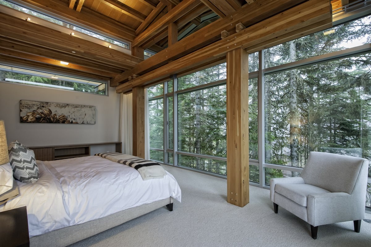Bedroom interior in a country house with panoramic windows Bedroom interior in a country house with panoramic windows