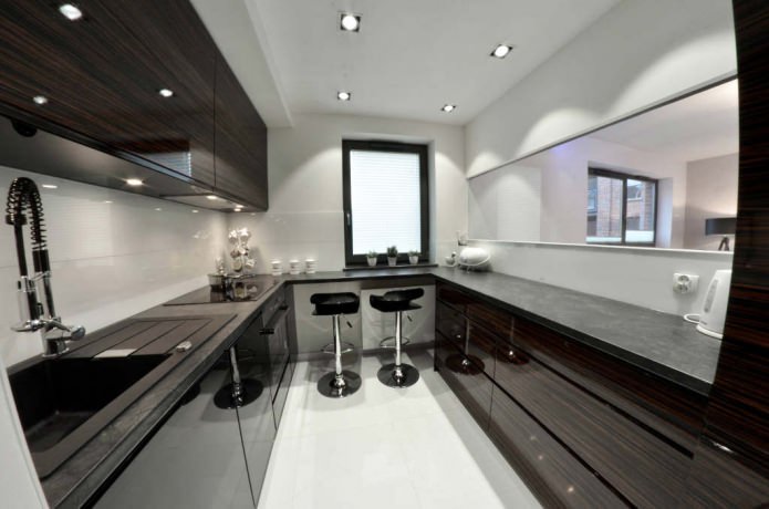 small kitchen with a bar by the window