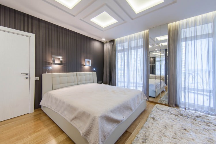 dark gray striped wallpaper in the bedroom