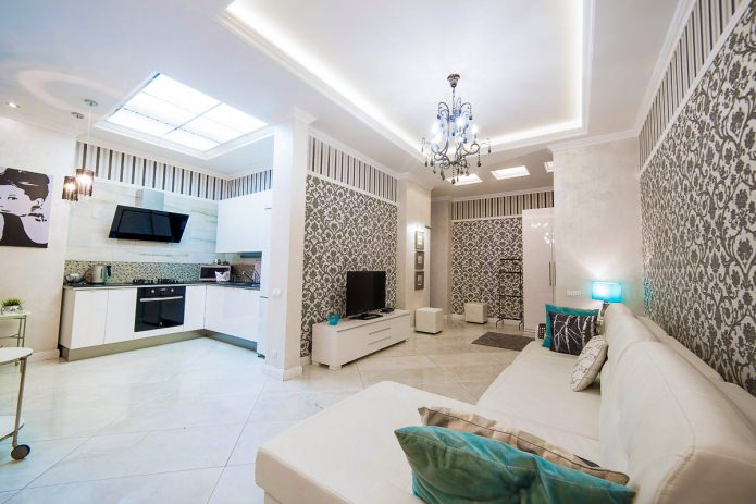 Black and white wallpaper in the interior of the kitchen-living room
