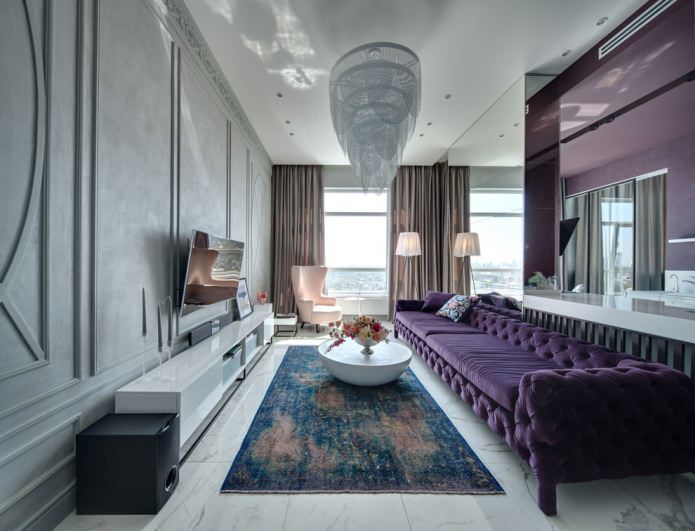 living room interior with purple sofa and beautiful chandelier