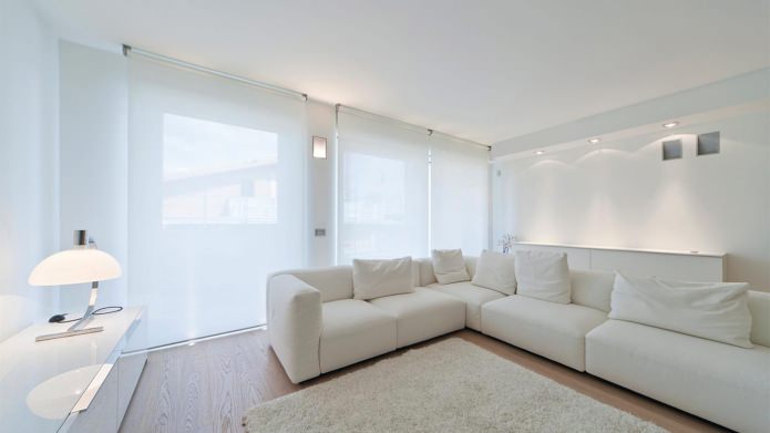 roller blinds in the interior of a white living room roller blinds in the interior of a white living room