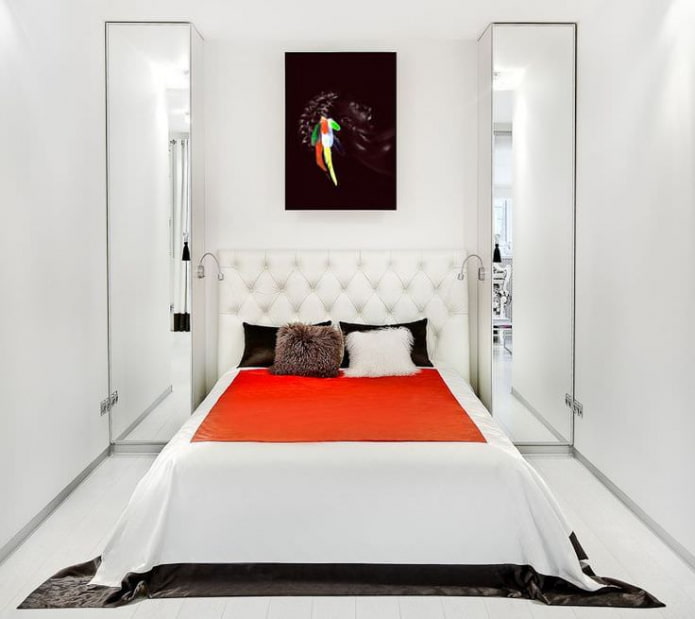 light narrow bedroom with a soft headboard