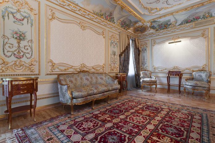 gold moldings on the walls