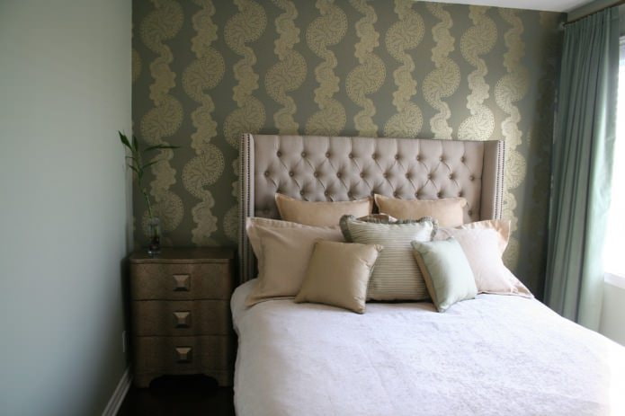 khaki wallpaper with shiny large gold ornament