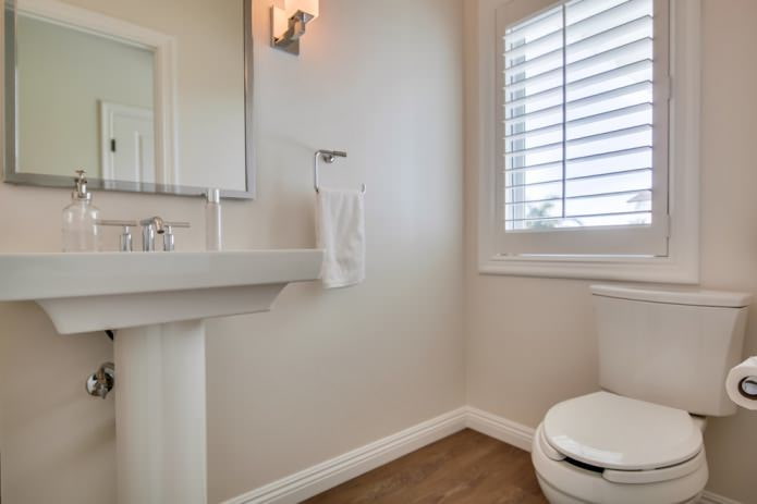 interior of a small modern bathroom with painted light walls