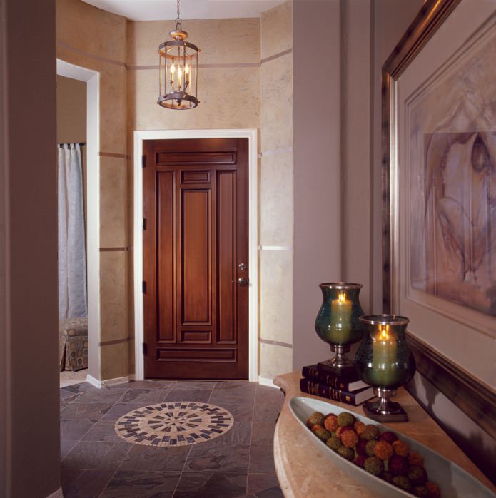 massive doors with a carved pattern in the interior of a classic hallway massive doors with a carved pattern in the interior of a classic hallway