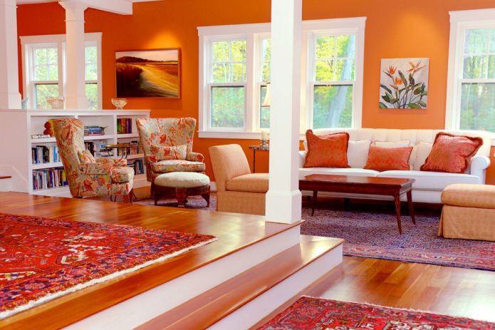 living room with orange walls