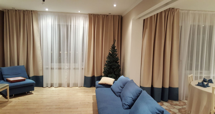 beige curtains with dark blue bottom