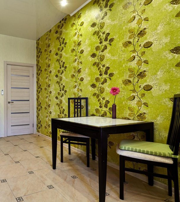 wallpaper of light green color in the interior of the kitchen