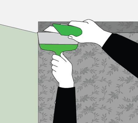 trimming wallpaper near the ceiling