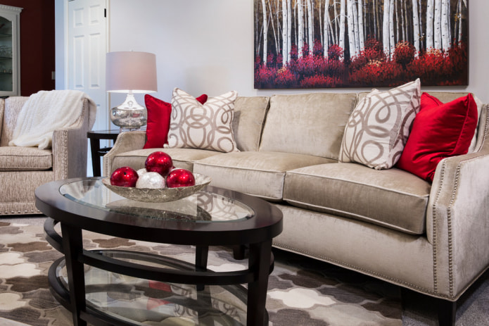 Beige sofa with red pillows Beige sofa with red pillows