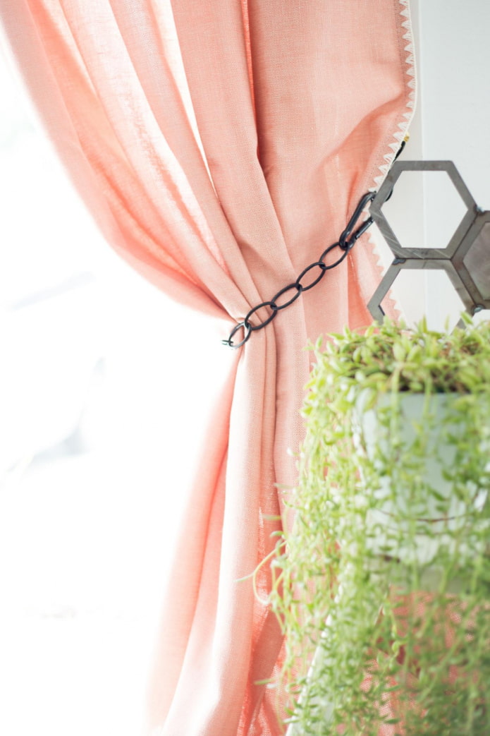 curtain decorated with black tie-back