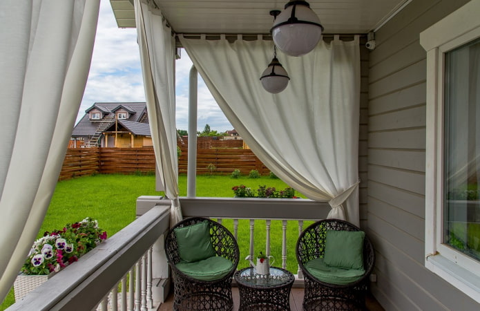 porch with canvas curtains