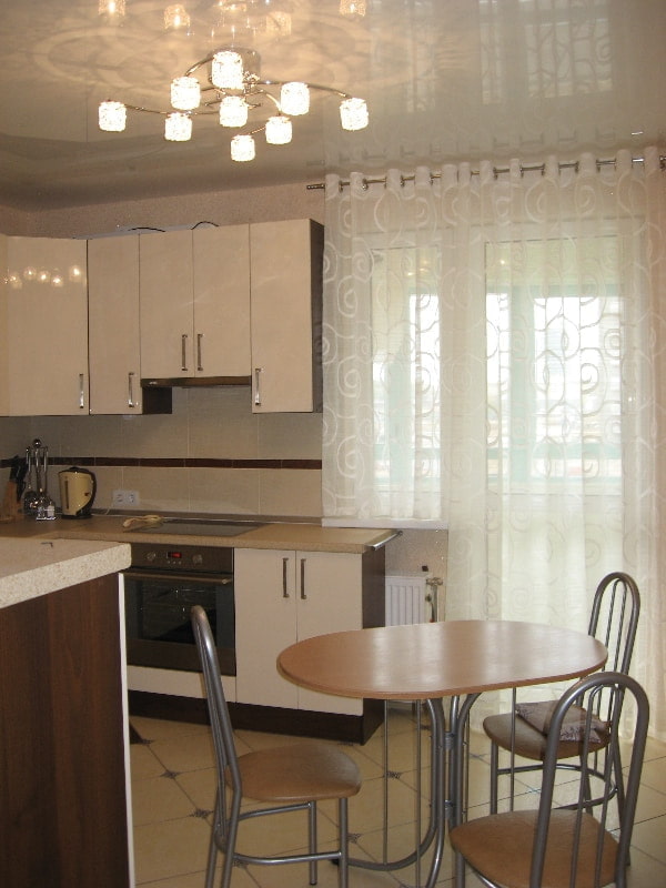 curtains on eyelets in the interior of the kitchen