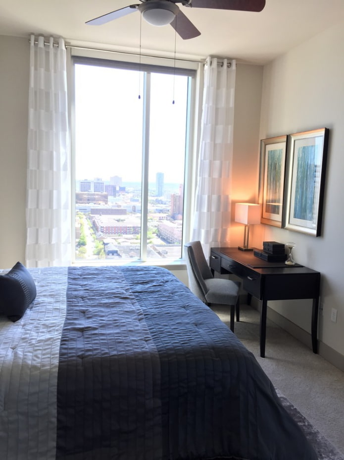 striped curtains in the interior of the bedroom