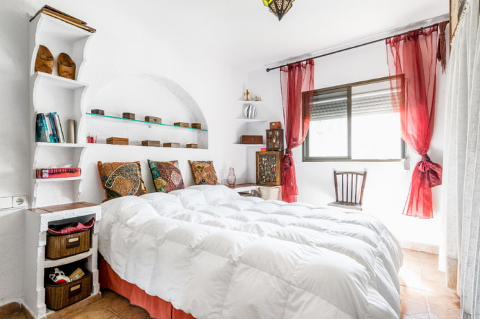 curtains of red color in the bedroom