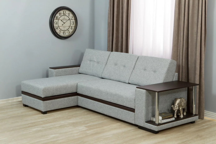 sofa with a table on the armrest
