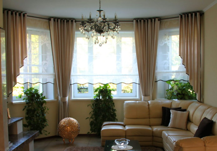 asymmetric curtains on the bay window in the living room