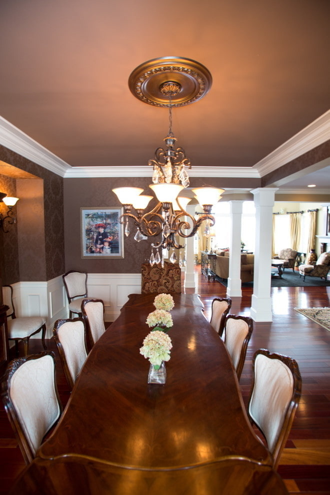 brown ceiling structure with chandelier