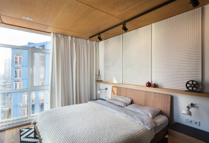 MDF panels on the ceiling in the interior of the bedroom