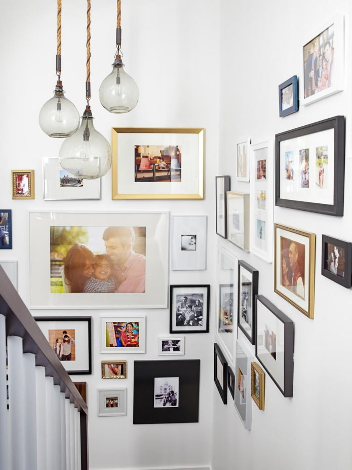 photographs in frames on the wall in the interior photographs in frames on the wall in the interior