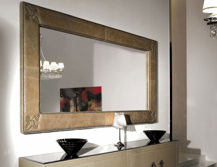 mirror in a leather frame in the interior of the hallway mirror in a leather frame in the interior of the hallway