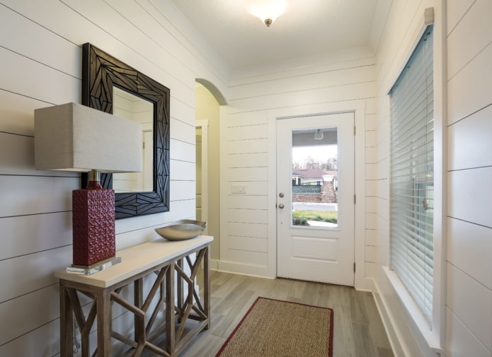 mirror in a wenge-colored frame in the interior of the hallway mirror in a wenge-colored frame in the interior of the hallway