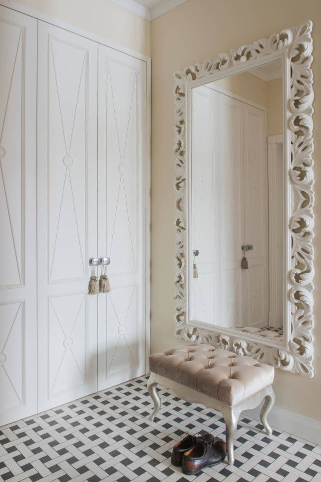 mirror in a white frame in the interior of the hallway mirror in a white frame in the interior of the hallway