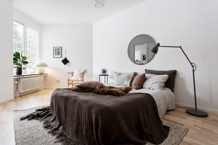 round mirror in the interior of the bedroom round mirror in the interior of the bedroom