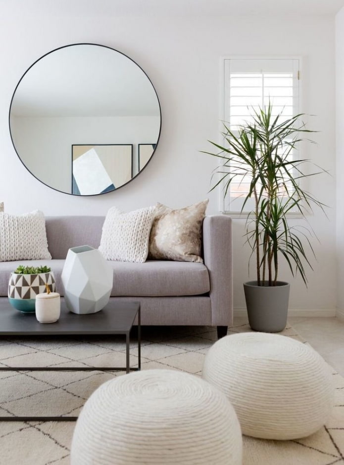 round mirror in the hall