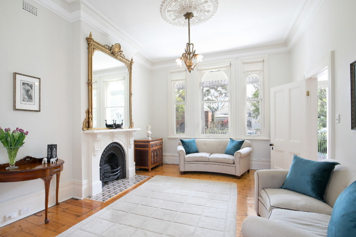 mirror on the fireplace in the interior of the hall