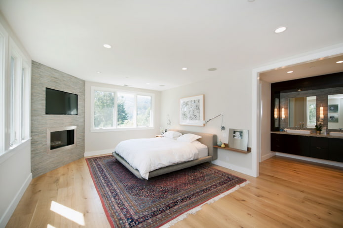 TV panel above the fireplace in the corner in the interior TV panel above the fireplace in the corner in the interior