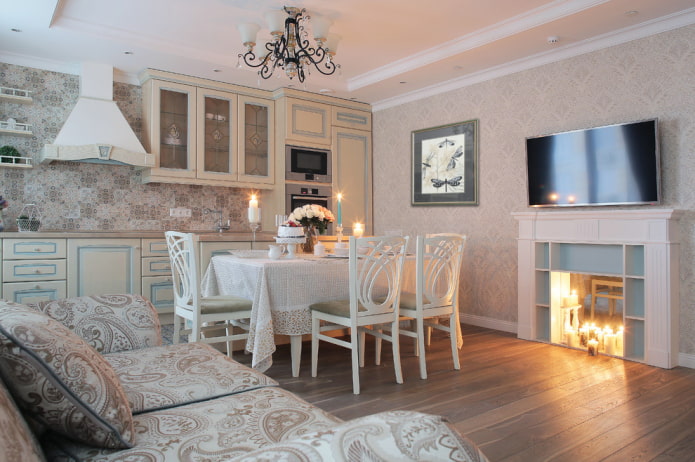 TV panel above the fireplace in the interior of the kitchen-living room TV panel above the fireplace in the interior of the kitchen-living room