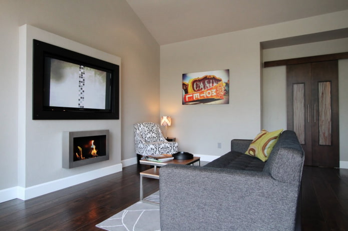 TV panel above the fireplace in the interior TV panel above the fireplace in the interior