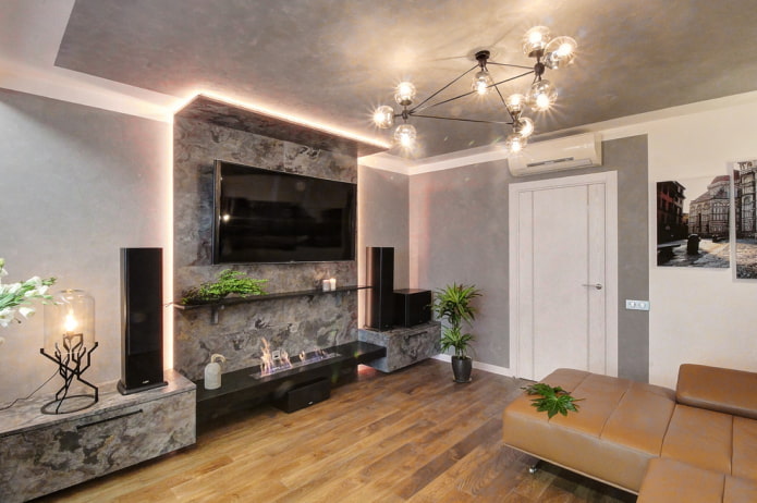 fireplace and TV in the interior of the living room in the apartment fireplace and TV in the interior of the living room in the apartment