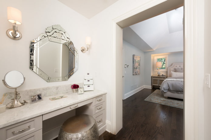 Venetian mirror on the wall in the interior Venetian mirror on the wall in the interior