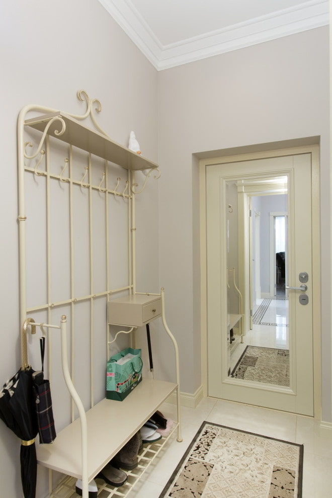 door with a mirror in the interior of the hallway