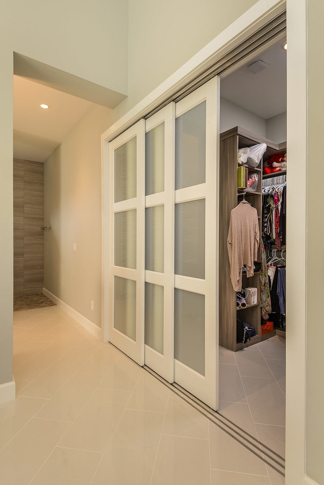 dressing room with white doors in the interior dressing room with white doors in the interior