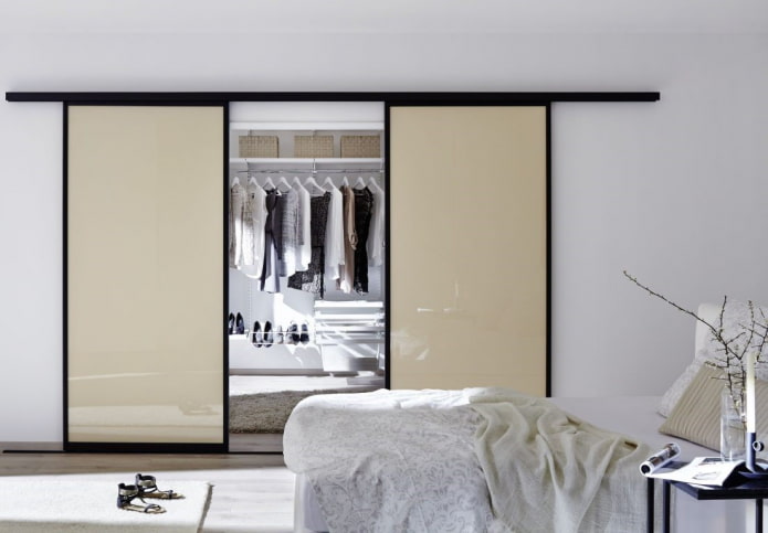 dressing room with beige doors in the interior dressing room with beige doors in the interior