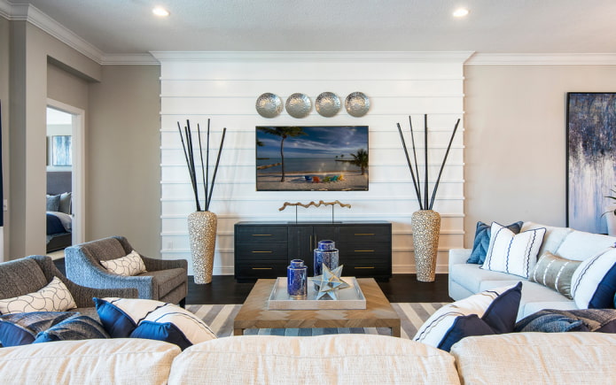 TV area with a wall decorated with panels