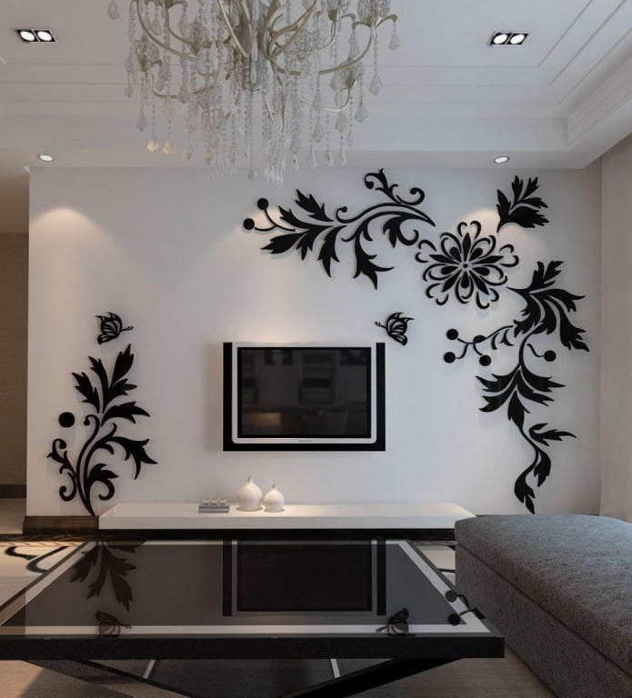 TV area with a wall with flowers in the interior