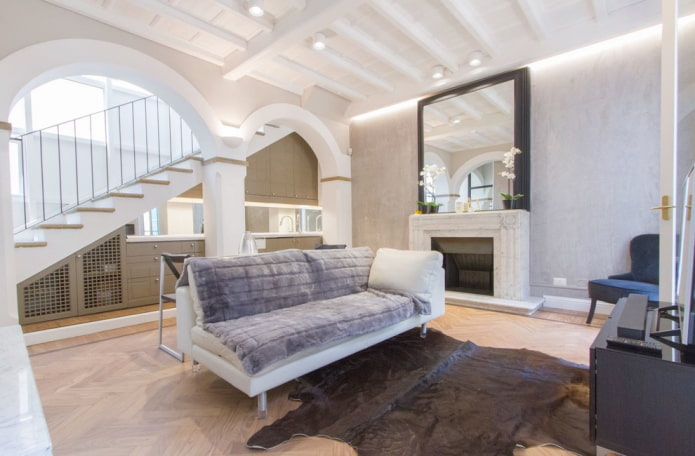 arch in the interior of the living room with a staircase arch in the interior of the living room with a staircase