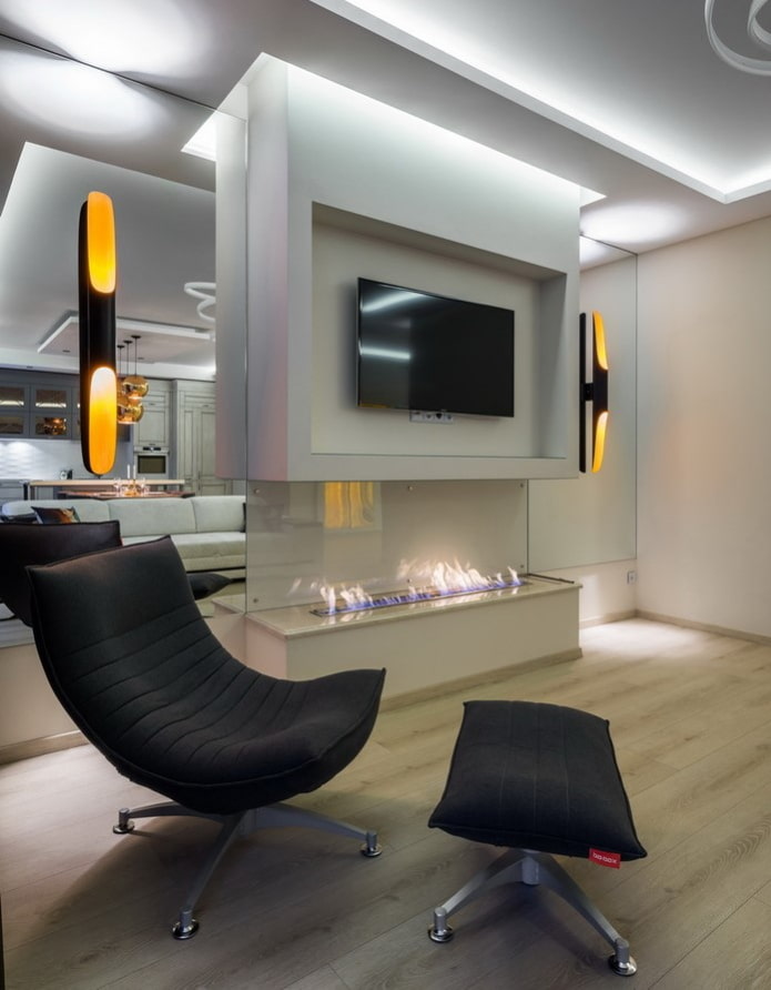 TV in a niche above the fireplace in the interior